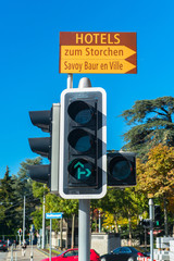 Red and green traffic lights against blue sky backgrounds