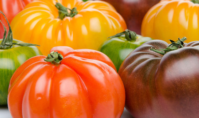 Green, yellow, orange and purple tomatoes