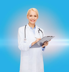 smiling female doctor with clipboard