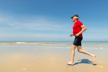 Senior runner at the beach