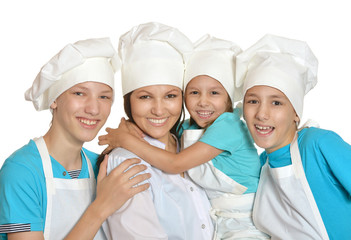 Mother and children in chef uniforms