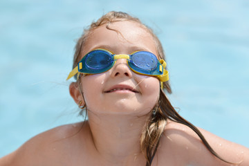 Happy child in a swimming pool