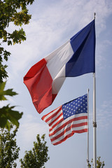 American and French waving flag at an memorial site in Caretan