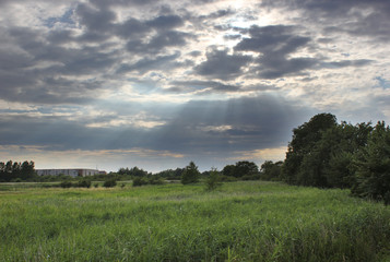 Fototapeta premium Sunbeams are breaking through the sky in Mecklenburg-Vorpommern, Germany