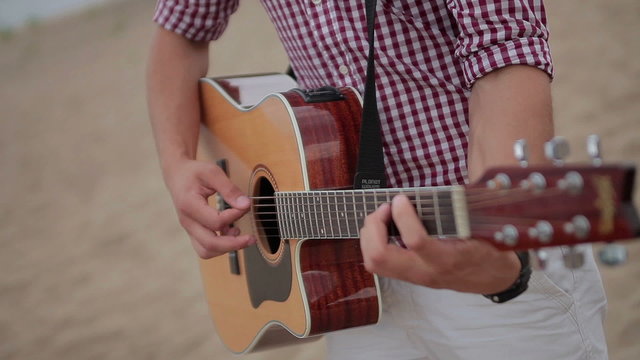acoustic guitar fretboard  hand