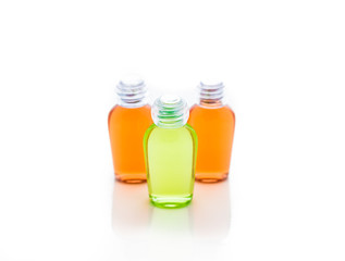 Orange and green bottle of shampoo, gel, soap