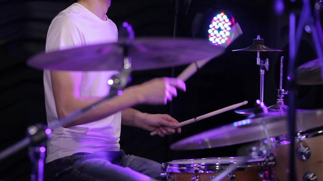drummer plays the drums