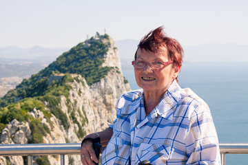 Naklejka premium Senior woman tourist at the Rock of Gibraltar