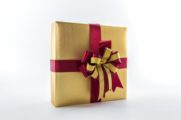 Gold and brown gift box with ribbon bow.