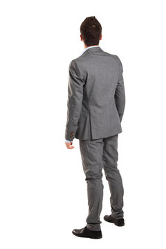 business man from the back - looking at something over a white 