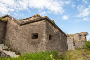 Fototapeta na wymiar Old concrete bunkers on Totleben fort island in Russia