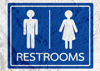 Restroom icon and Pictogram Man Woman Sign on Cement wall textur