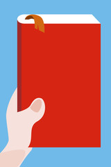 A hand holding a book