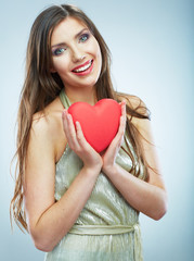 Red heart. Love symbol. Portrait of beautiful woman hold Valent