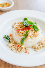 Spicy fried chicken with basil and rice