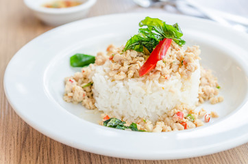 Spicy fried chicken with basil and rice