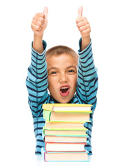 Little boy is reading a book