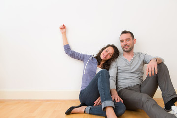 Fototapeta na wymiar Young couple in their brand new flat / Textspace