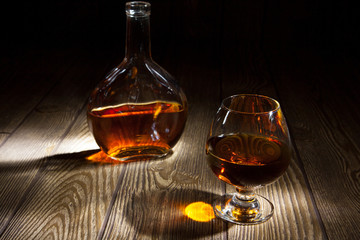 Bottle with a glass of brandy