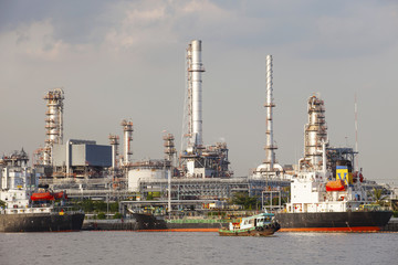 Fototapeta premium oil refinery and tanker ship on port in heavy industry use for e
