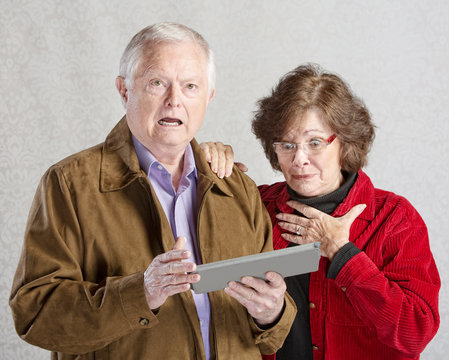 Startled Couple With Tablet