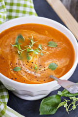 Tomato soup in white bowl