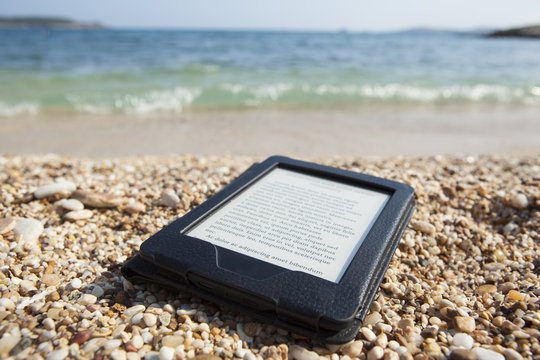 ebook reader on beach