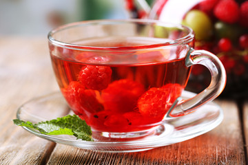 Fruit red tea with wild berries in glass cup,