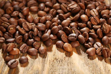 Coffee beans on rustic wooden background