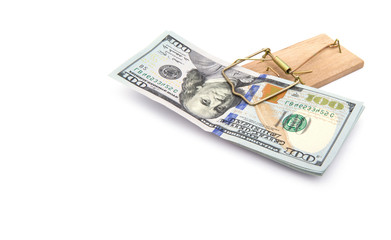 Money in a mousetrap on a white background