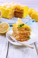 Tasty lemon dessert on wooden table
