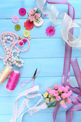 Scrapbooking craft materials on color wooden background