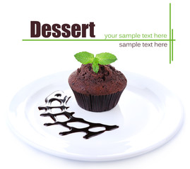 Chocolate muffin on plate isolated on white