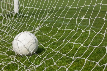 Football at the back of the net