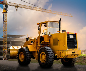 yellow tractor on the road - 68427402