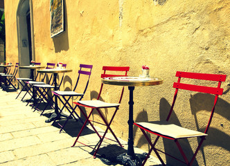 Cafe tables on a street in Ajaccio, France