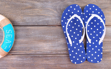 Color flip-flops on wooden background