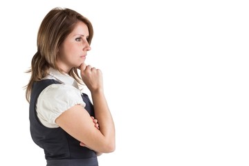 Fototapeta premium Side view of a thoughtful young businesswoman