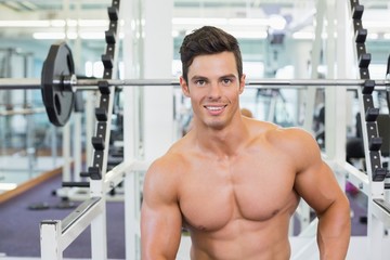 Fototapeta na wymiar Portrait of a muscular man in gym