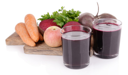 Glasses of fresh beet juice and vegetables