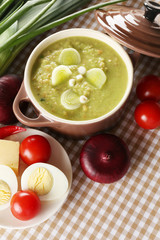 Leek soup on table, close up