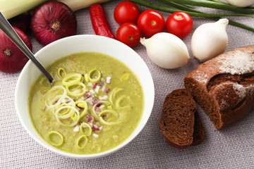 Leek soup on table, close up