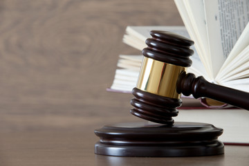 wooden gavel and books