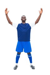 Football player in blue celebrating a win