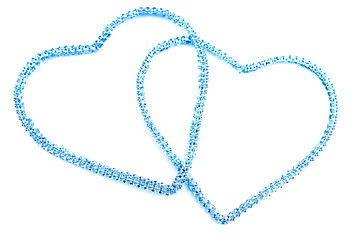 Zwei ineinander verschlungene blaue Herzen