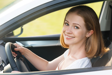 Fototapeta na wymiar female driver driving a car