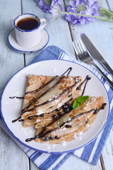 Delicious pancakes with blueberries on table close-up