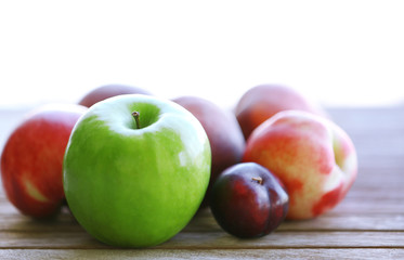 Juicy fruits on wooden table, close-up