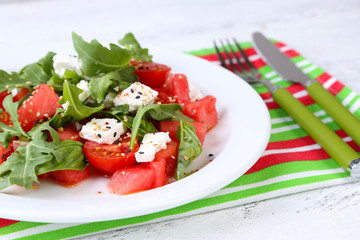Salad with watermelon,tomatoes,  feta, arugula and basil leaves
