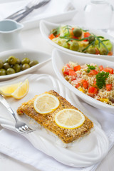 Baked fish fillet wih couscous salad